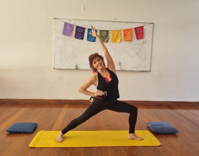 A person doing yoga in front of a white board AI-generated content may be incorrect.